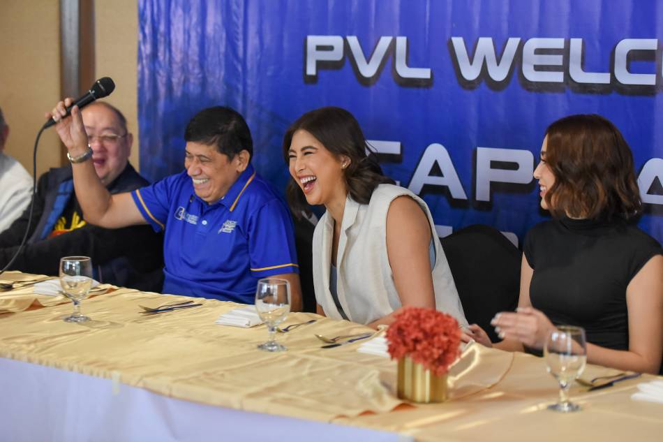 Capital1 team owners Mandy and Milka Romero, daughters of sports patron Congressman Mikee, share a light moment with coach Roger Gorayeb in a press conference in Makati City on January 25, 2023. Photo from PVL Media Bureau