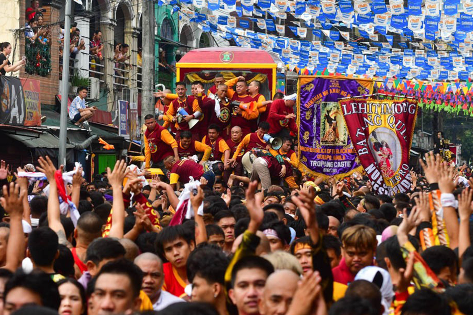 A throng of devotees participates in the annual Traslacion as it passes Arlegui en route to Fraternal Street in Quiapo, Manila on January 9, 2024. Mark Demayo, ABS-CBN News.