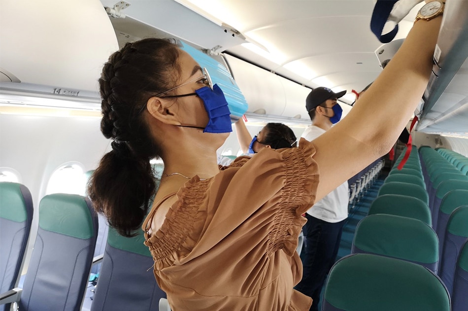 A peek at your next Cebu Pacific flight—masks on, vacant middle seats, cabin crew in PPEs 5