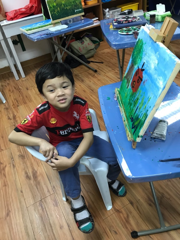  Sevi with his first completed piece at art therapy. Jan 2018, 5 years old