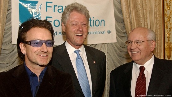 As an activist, Bono has met people such as Bill Clinton (center) and Mikhail Gorbachev (right)
