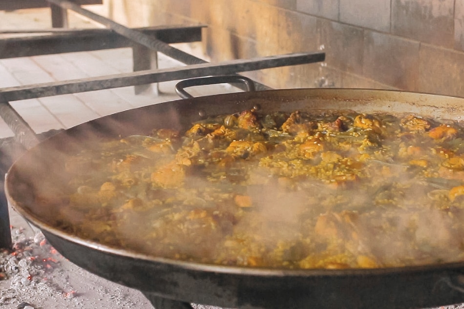 To truly appreciate paella in Valencia, one must witness its making in a farmhouse 8