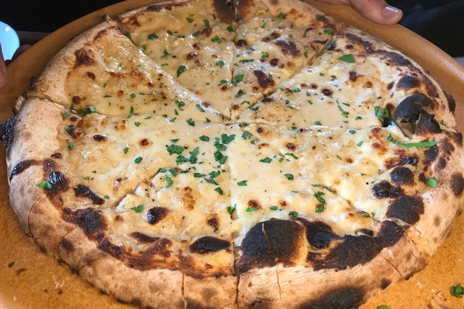 Cacio e Pepe pizza with three kinds of cheeses.