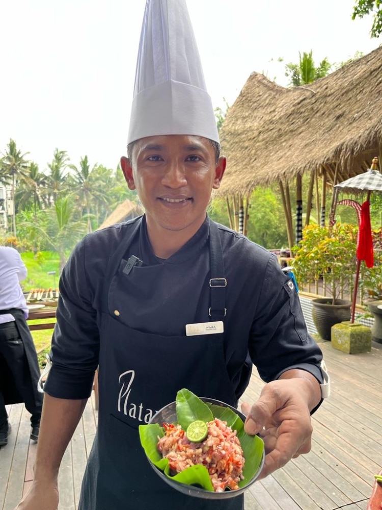 Plataran’s Chef showing the salad he taught us to make.