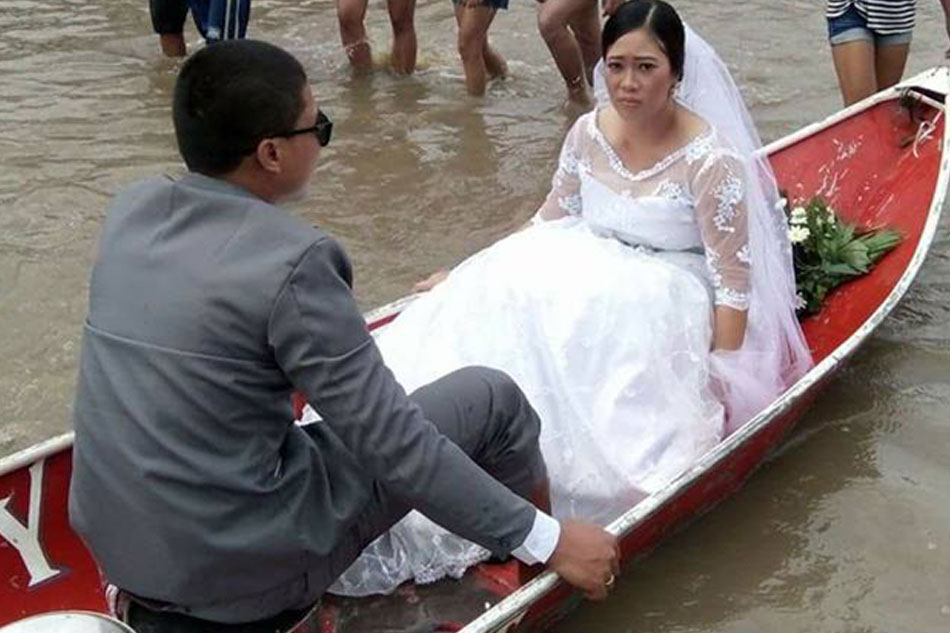 LOOK: Amid typhoon, couple pushes through with wedding 4